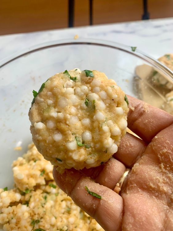 Step 3.2: Take small portions of the mixture, roll into balls, and flatten gently into tikkis or patties