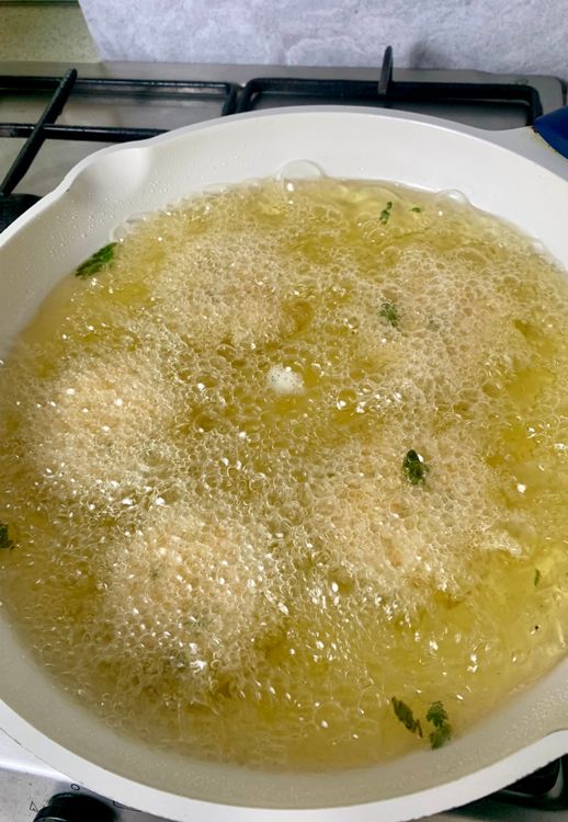 Step 4.1: Gently slide the vadas into the hot oil, a few at a time