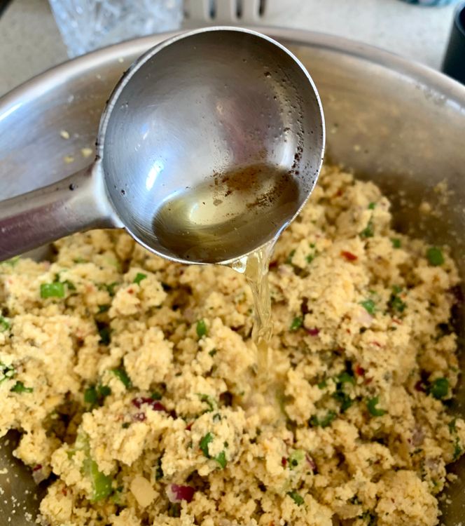 Step 1.1: Transfer the mixture to a mixing bowl and add shallots, salt, hing and the reserved dal