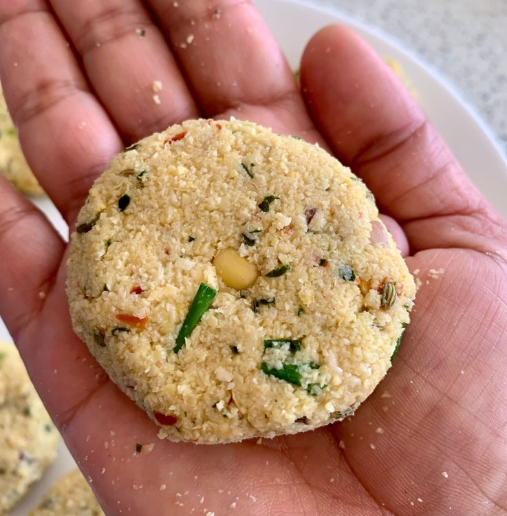 Step 1.1: Apply a little oil to your palm, then take small portions of the mixture, shape them into lemon-sized balls, and flatten them on your palm
