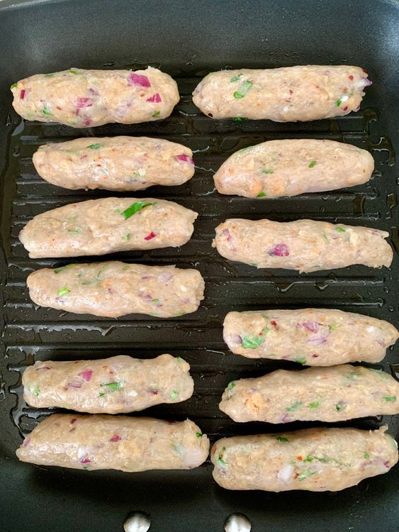 Step 3.1: Cook the seekhs on medium heat until golden outside but slightly raw inside (about 4-5 minutes)