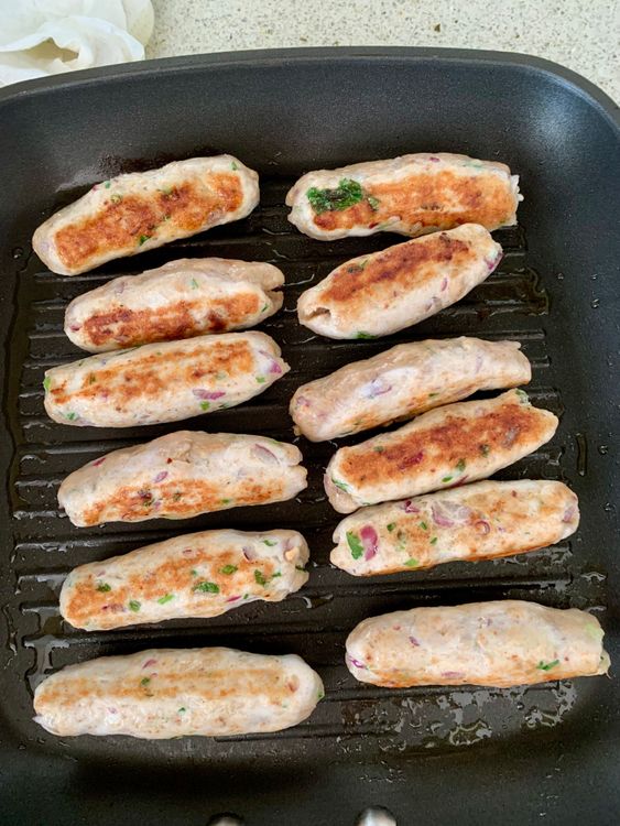Step 3.2: Cook the seekhs on medium heat until golden outside but slightly raw inside (about 4-5 minutes)