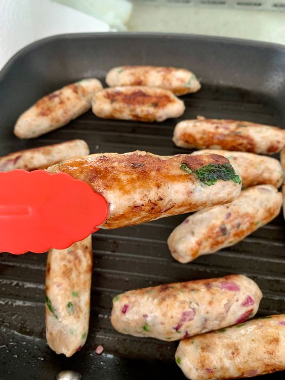 Step 3.3: Cook the seekhs on medium heat until golden outside but slightly raw inside (about 4-5 minutes)