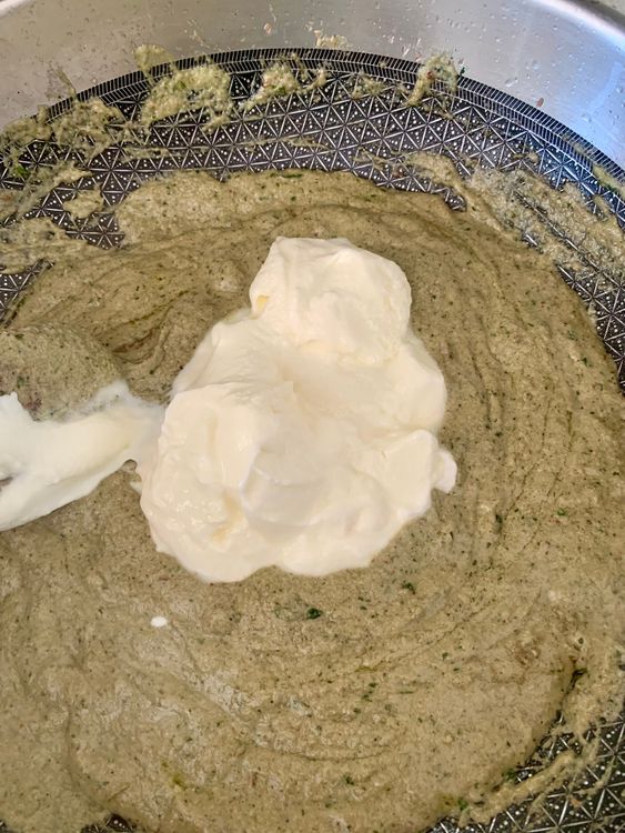 Step 5.1: Reduce heat, add curd gradually while stirring to prevent curdling