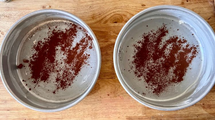 Step 1.1: Start by greasing two 8 or 9 inch cake pans with the plant-based butter