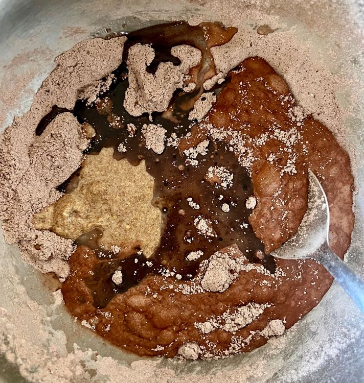Step 1.2: In a large bowl, mix your flour, sugar, cocoa powder, baking soda, and salt together