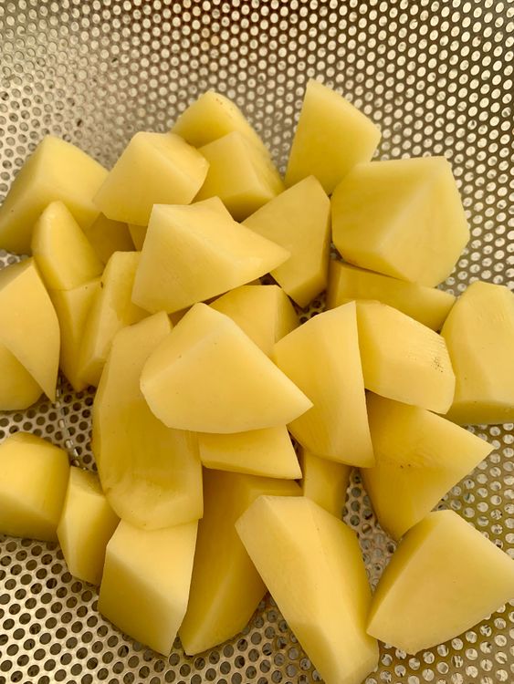 Step 1.1: Peel and cube the potatoes