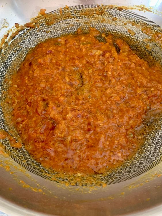 Step 2.2: Mix in salt, red chilli powder, turmeric, and 2–3 tablespoons of water