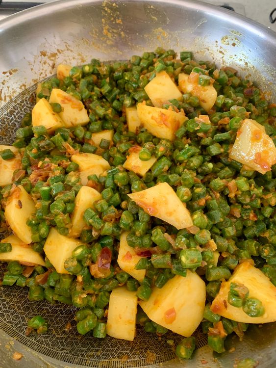 Step 2.2: Add the beans, pour in ¼ cup water, cover, and cook over low-medium heat until the beans are tender and potatoes are fully cooked