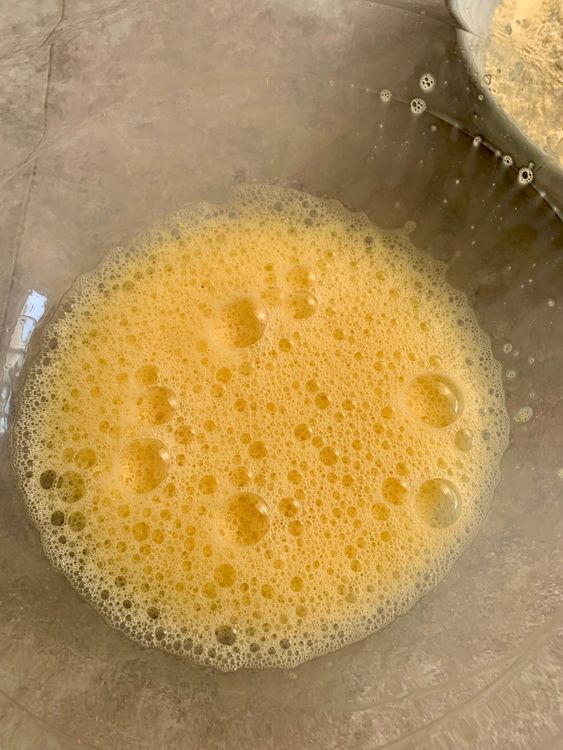 Step 1.1: In a large bowl, beat the eggs until light and frothy