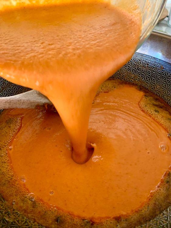 Step 2.1: Pour in the ground mixture, add sugar and green chillies, and mix