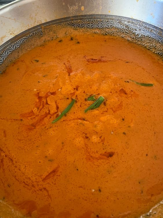 Step 2.3: Pour in the ground mixture, add sugar and green chillies, and mix