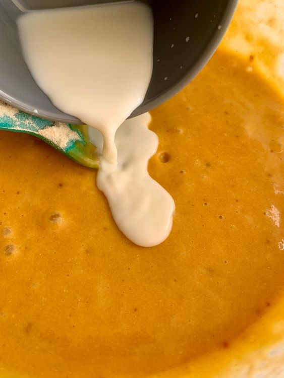 Step 1.2: Add the dry ingredients to the wet mixture in 2–3 batches, alternating with milk