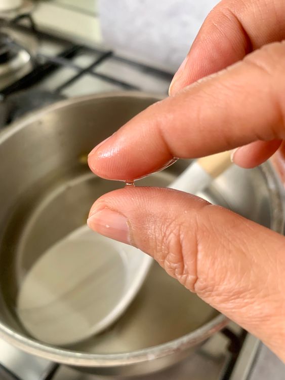 Step 1.1: Add cardamoms and lemon juice, bring to a boil, then simmer for 5–8 minutes until slightly sticky (no need for string consistency)