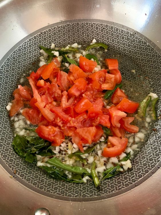 Step 3.1: Add diced tomatoes, stir, and cook for 3-4 minutes