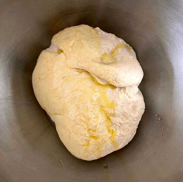 Step 1.1: Coat a bowl in a generous amount of olive oil, and stick the dough in it