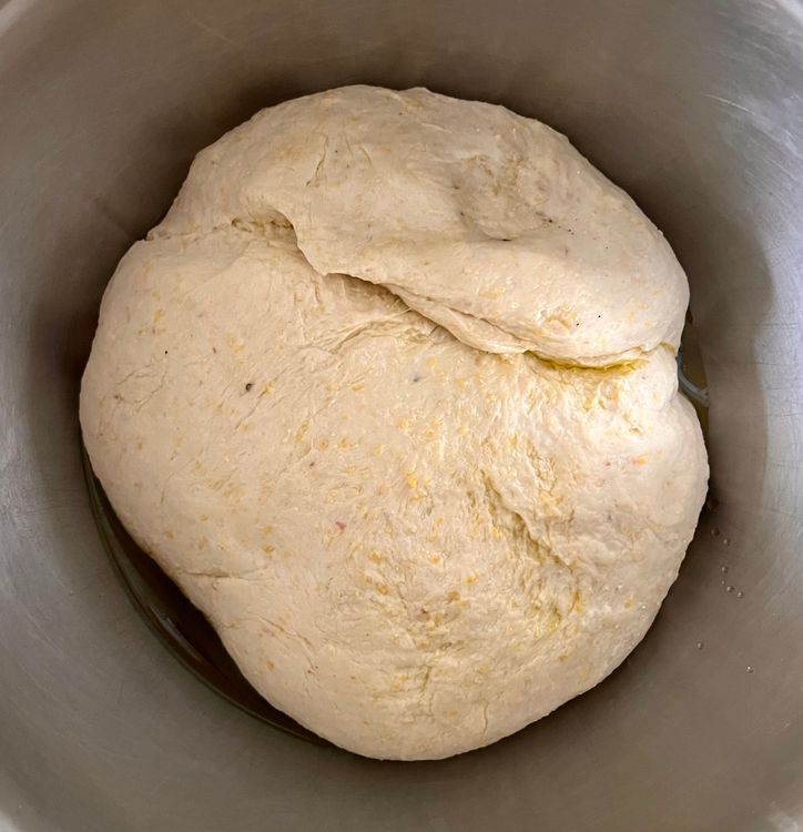 Step 1.2: Coat a bowl in a generous amount of olive oil, and stick the dough in it