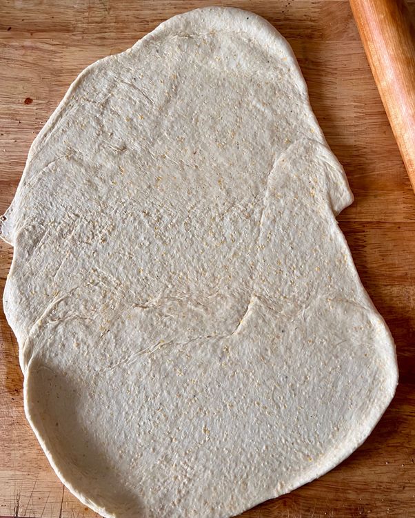 Step 1.1: Once the dough has risen, take it out of the bowl and onto a lightly floured board