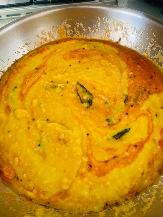 Step 3.1: Add the boiled dal and sugar, stirring well
