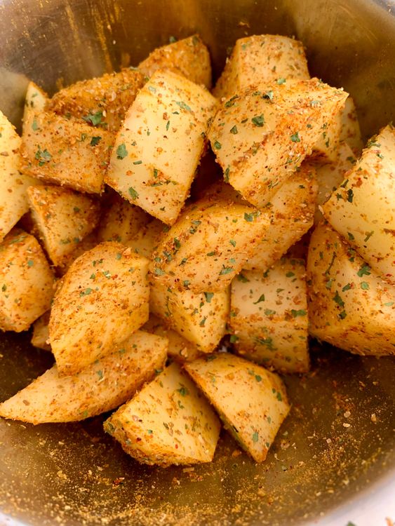 Step 2.1: Toss the potato cubes with any leftover spice mix and keep aside