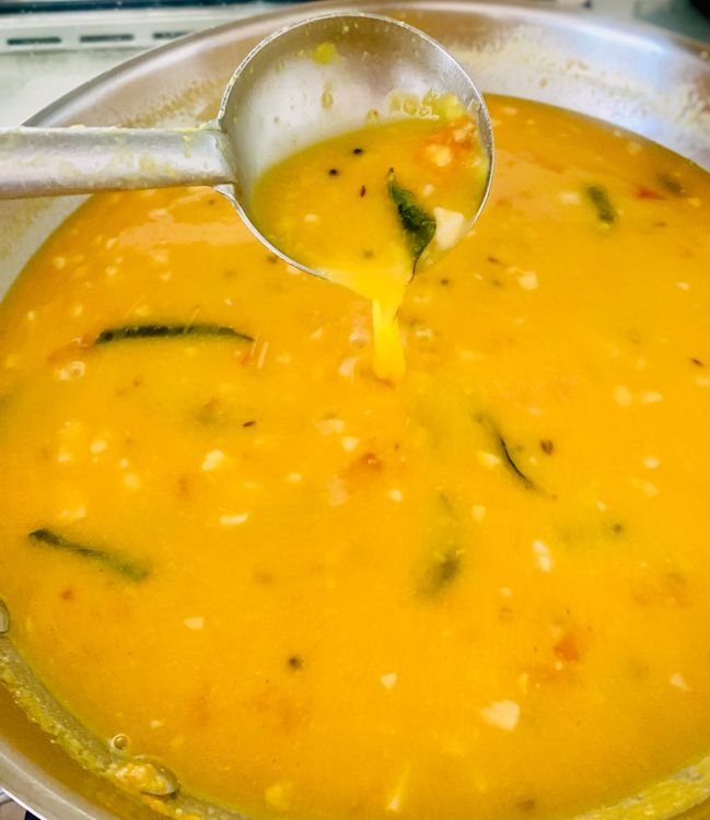 Step 3.2: Add the boiled dal and sugar, stirring well