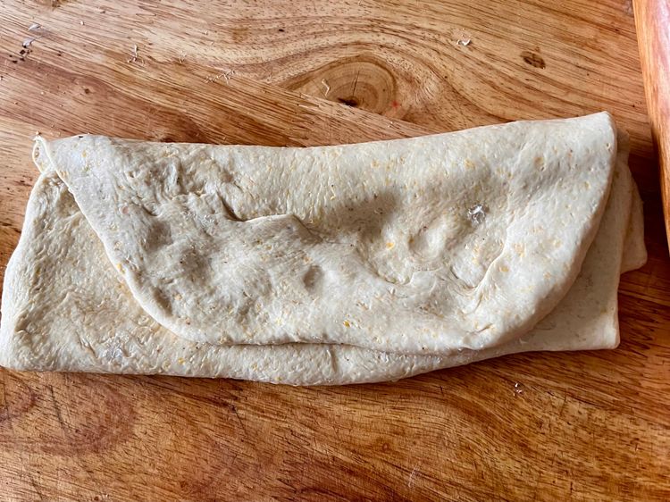 Step 1.2: Once you've spread the butter, fold each piece of dough over itself twice, like you would a business letter