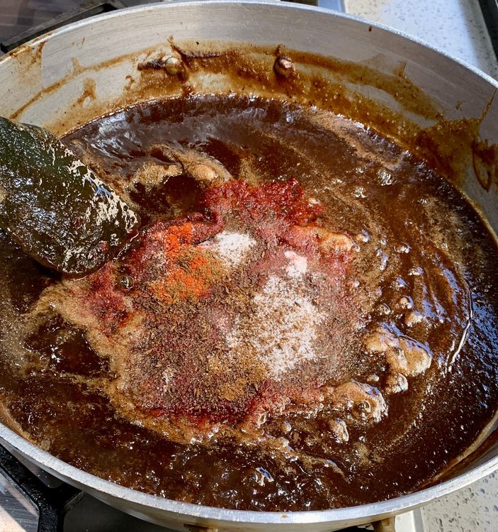 Step 1.1: Add the roasted cumin powder, red chilli powder, salt, cumin seeds, and oil to the saucepan