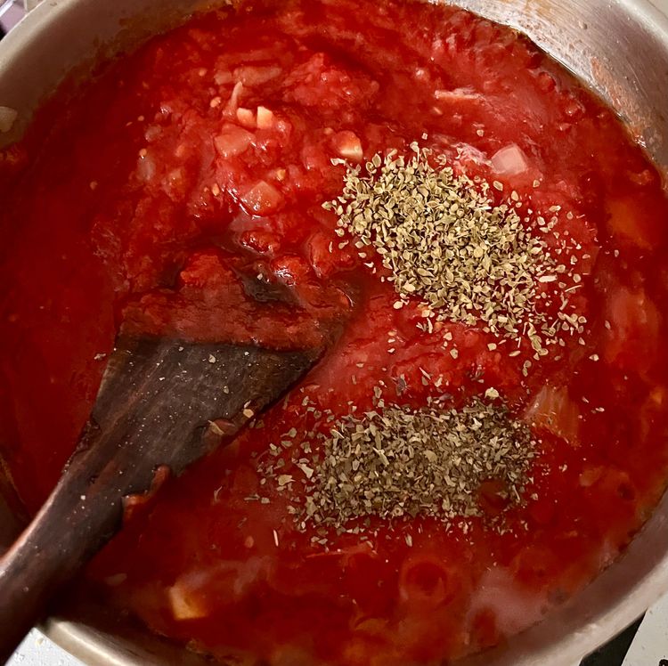 Step 1.1: Add your crushed tomatoes, sugar, and oregano, if using