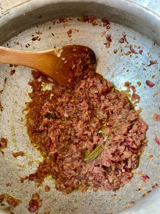 Step 2.1: Add onions and sauté until golden brown and the oil begins to release