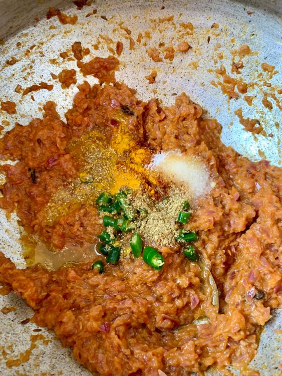 Step 2.1: Mix in turmeric, red chilli powder, coriander powder, salt, and chopped green chillies