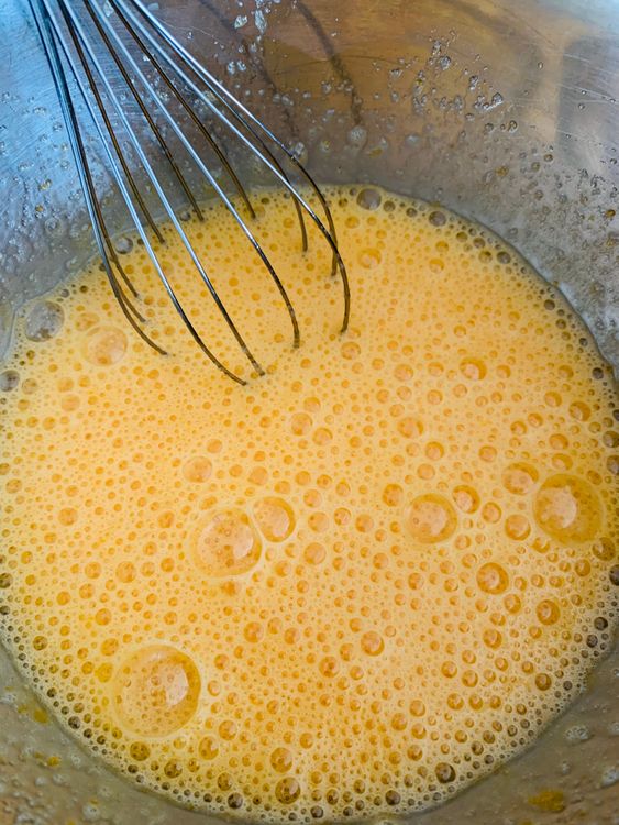 Step 3.2: In another large bowl, whisk the eggs and sugar until pale and frothy