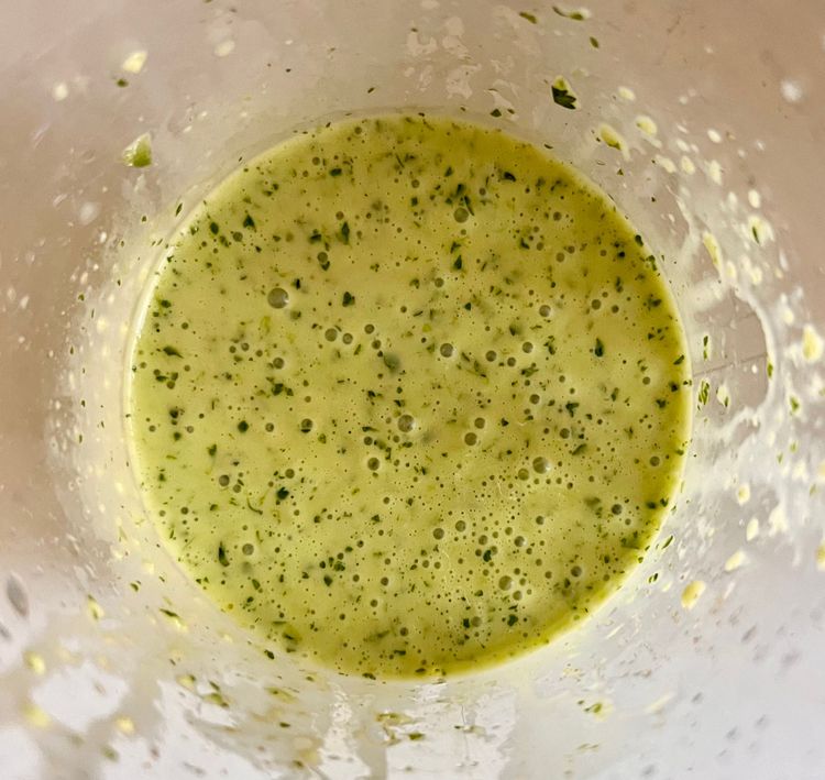 Step 1.1: While the blender or immersion blender is running, slowly add in the olive oil
