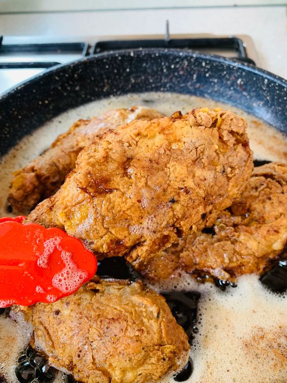 Step 5.3: Fry the chicken in batches for 3–4 minutes undisturbed, then another 8–10 minutes, turning occasionally, until golden brown and fully cooked