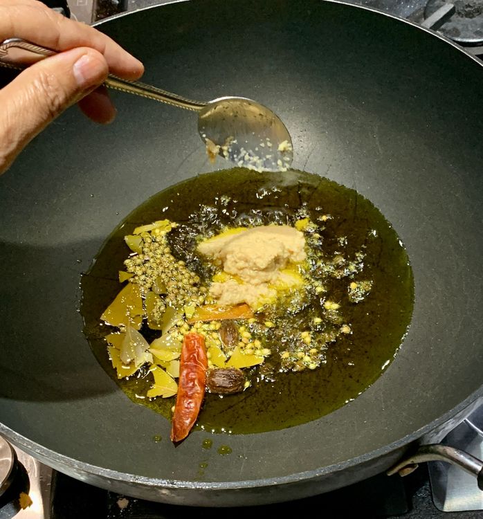 Step 1.1: Stir in the ginger-garlic paste and cook for 2-3 minutes until the raw smell subsides