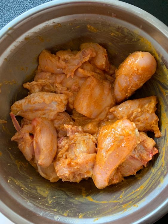 Step 1.1: In a large bowl, combine chicken with turmeric, Kashmiri chilli powder, lemon juice, ginger-garlic paste, and salt