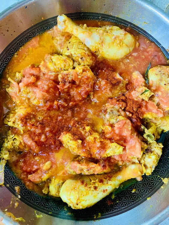 Step 3.1: Mix in tomatoes, Kashmiri chilli powder, and salt