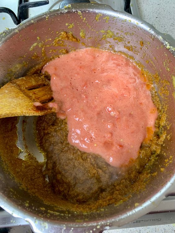 Step 2.1: Add the tomato puree and cook for 3–4 minutes until the raw smell disappears, and the moisture reduces