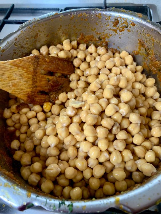Step 3.1: Add the soaked chickpeas to the masala and mix well