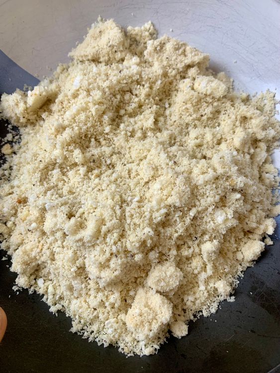 Step 1.1: Transfer the roasted makhana to a bowl, let them cool, and then grind them into a coarse powder