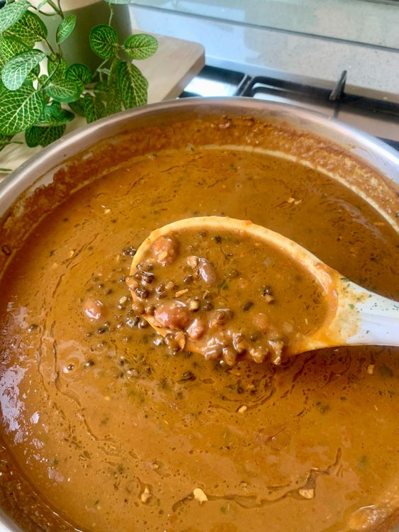 Step 3.1: Pour the tempering over the dal and stir gently