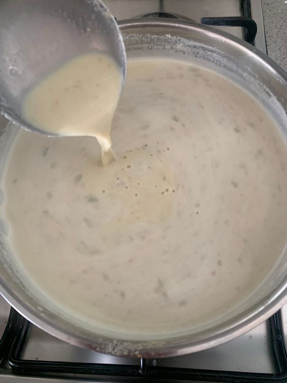 Step 2.2: Stir in the thandai paste, and let the mixture simmer on low heat for 5-7 minutes, stirring occasionally