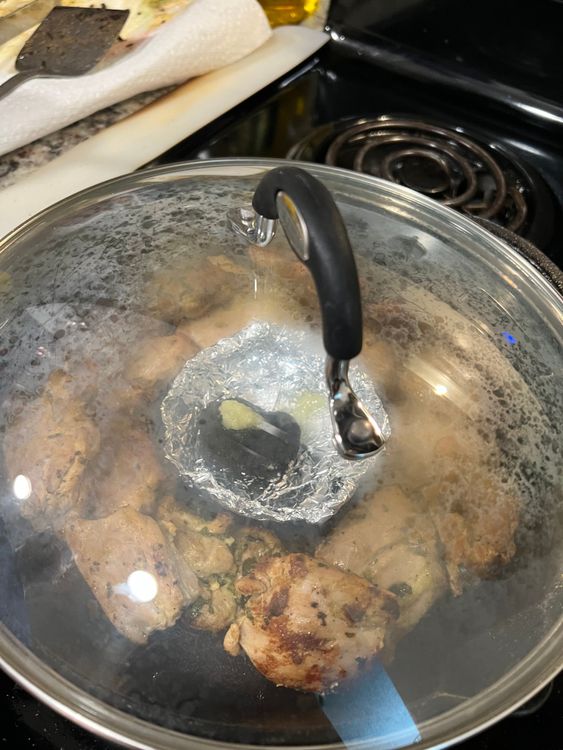 Step 1.2: Once the chicken is cooked, take a small piece of charcoal and burn it on the flame for 1-2 mins and add that in a piece of foil