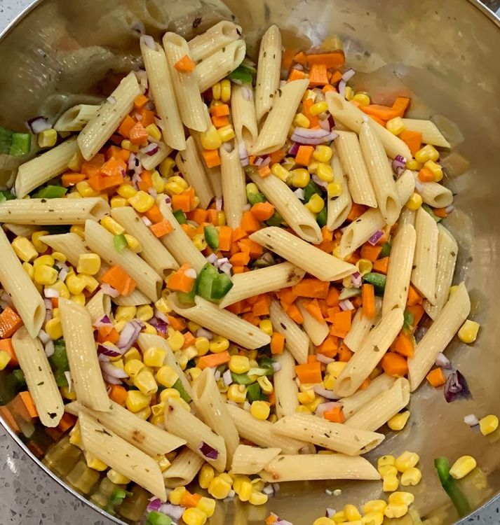 Step 1.1: Combine boiled pasta, corn kernels, onions, capsicum and carrots in a large mixing bowl