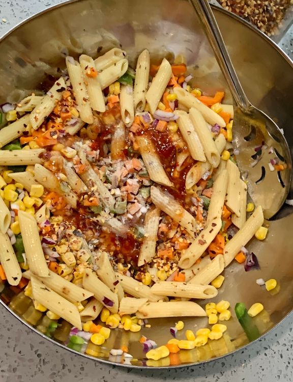 Step 1.1: Add chilli flakes, white pepper powder, black pepper, sweet chilli sauce, and salt to the salad bowl