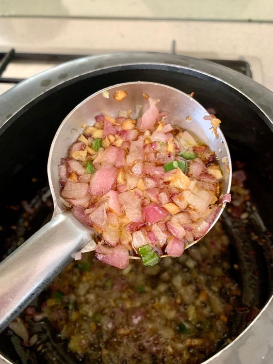 Step 3.1: Stir in onions and green chilli, cooking until the onions turn translucent
