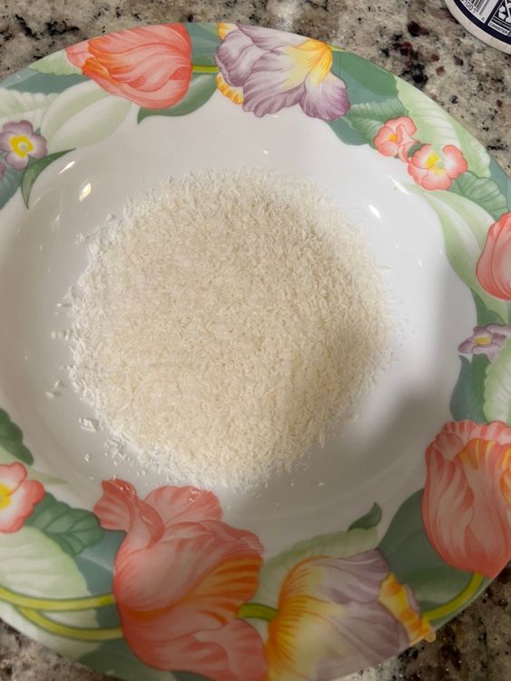 Step 1.2: Once it gets to room temperature, make small balls of the mix and roll them in the leftover 1/2 cup desiccated coconut