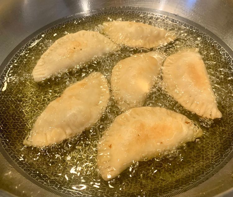 Step 6.1: Â Heat oil in a deep pan over medium heat