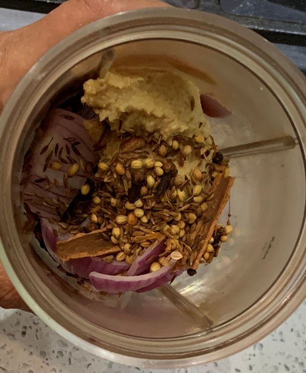 Step 1.1: Add the roasted spices to the grinder and grind them into a fine paste, adding water if needed