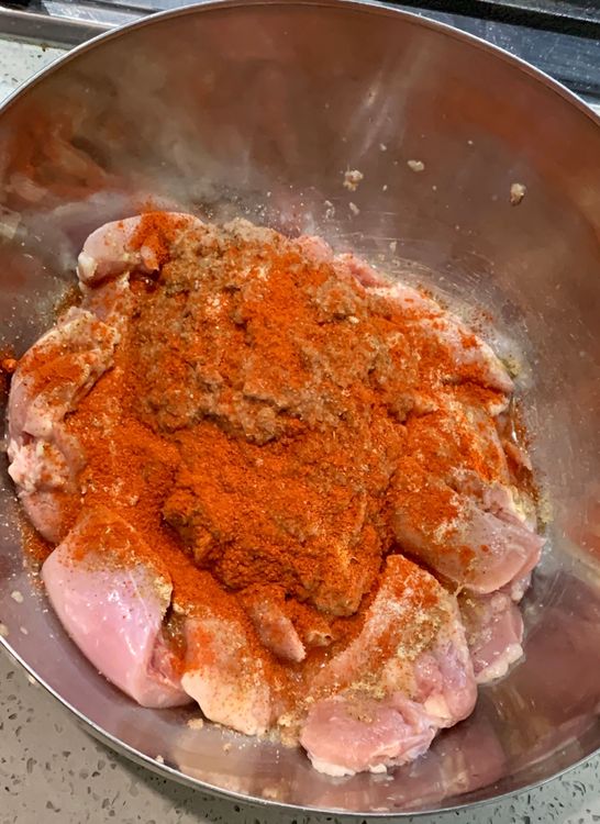 Step 1.2: Marinate the chicken pieces with the blended paste, 2 tbsp oil, salt, chat masala, paprika powder and lemon juice in a bowl
