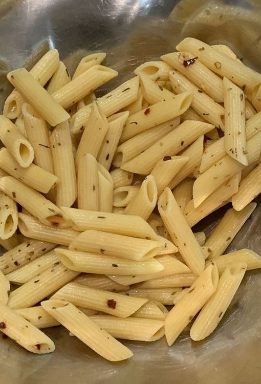 Step 1.1: In a pan, boil water and add the pasta, mixed herbs, and olive oil